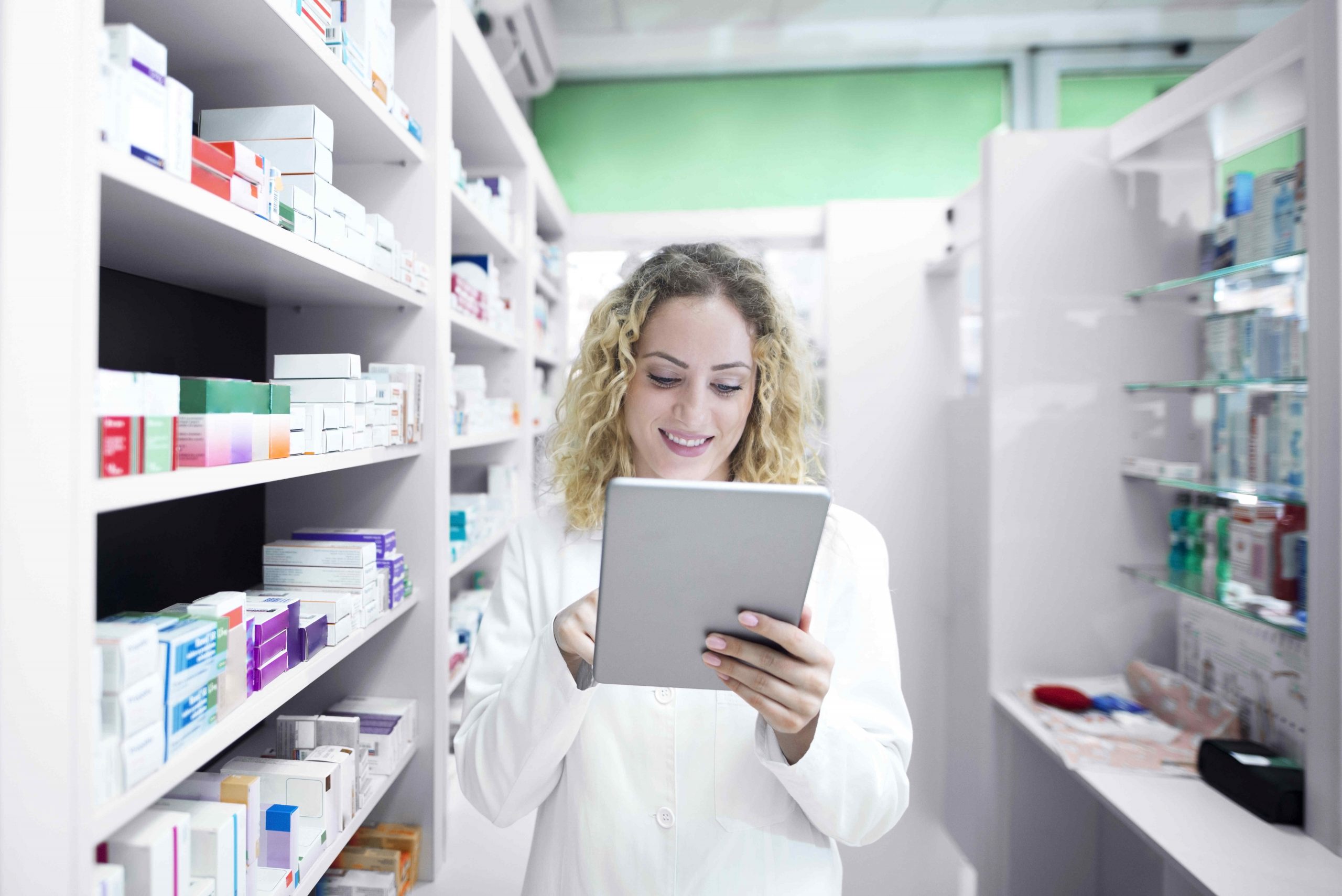 female pharmacist working drug store